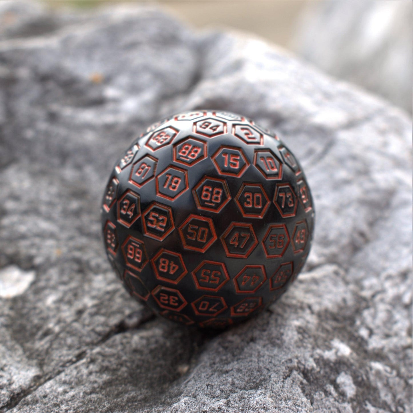 The Orb D100 - Black and Orange Metal Die