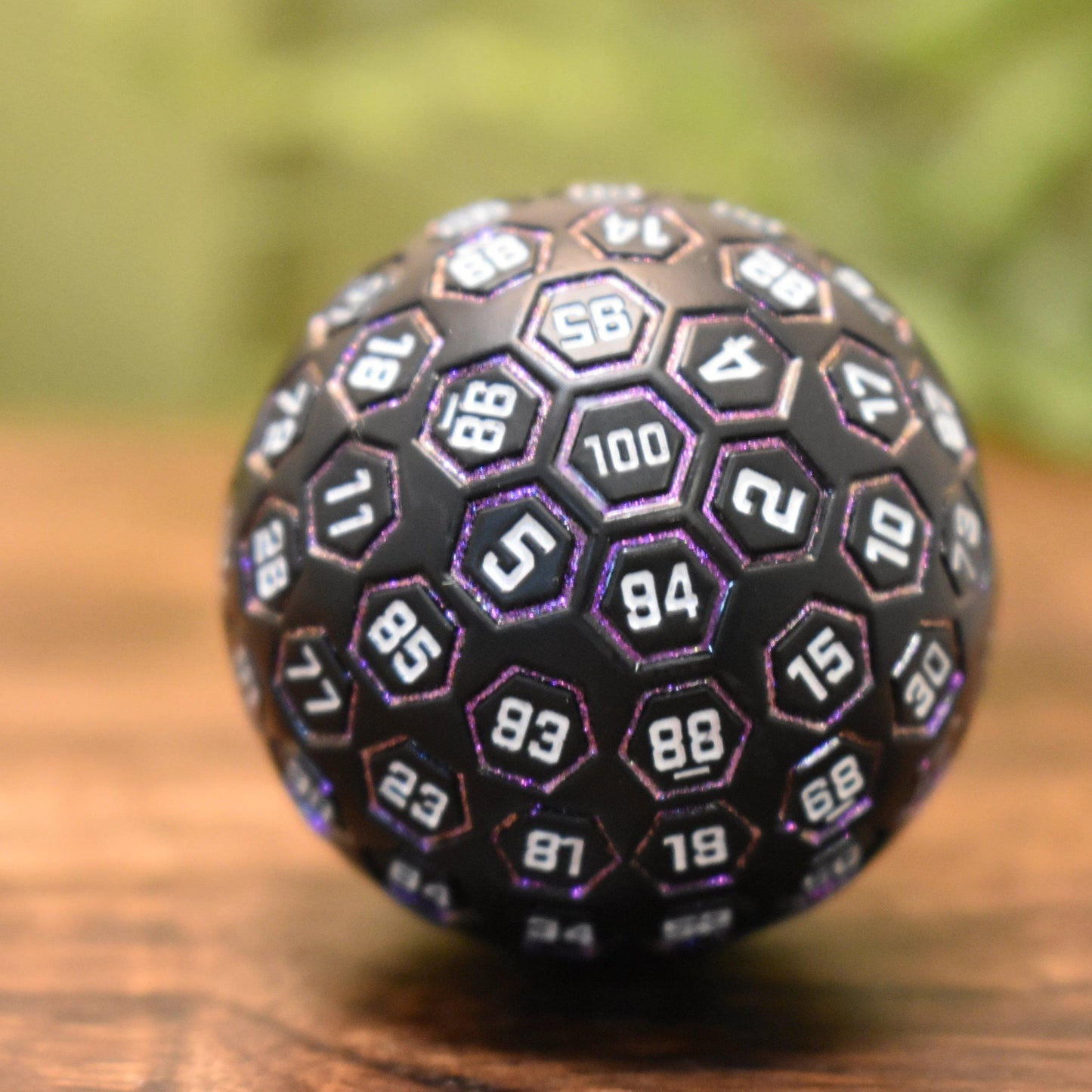 The Orb D100 - Purple, White, and Black Metal Die